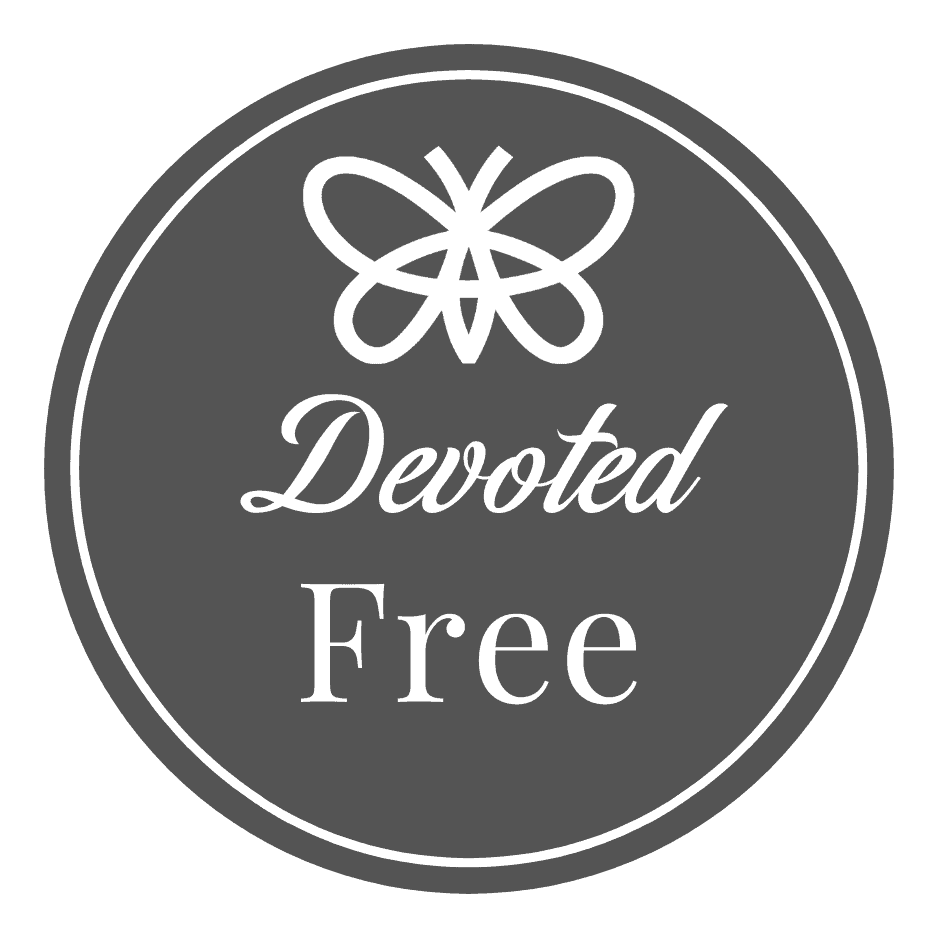 A gray circular badge with a white butterfly icon above the words "Devoted Free" in script and serif fonts.