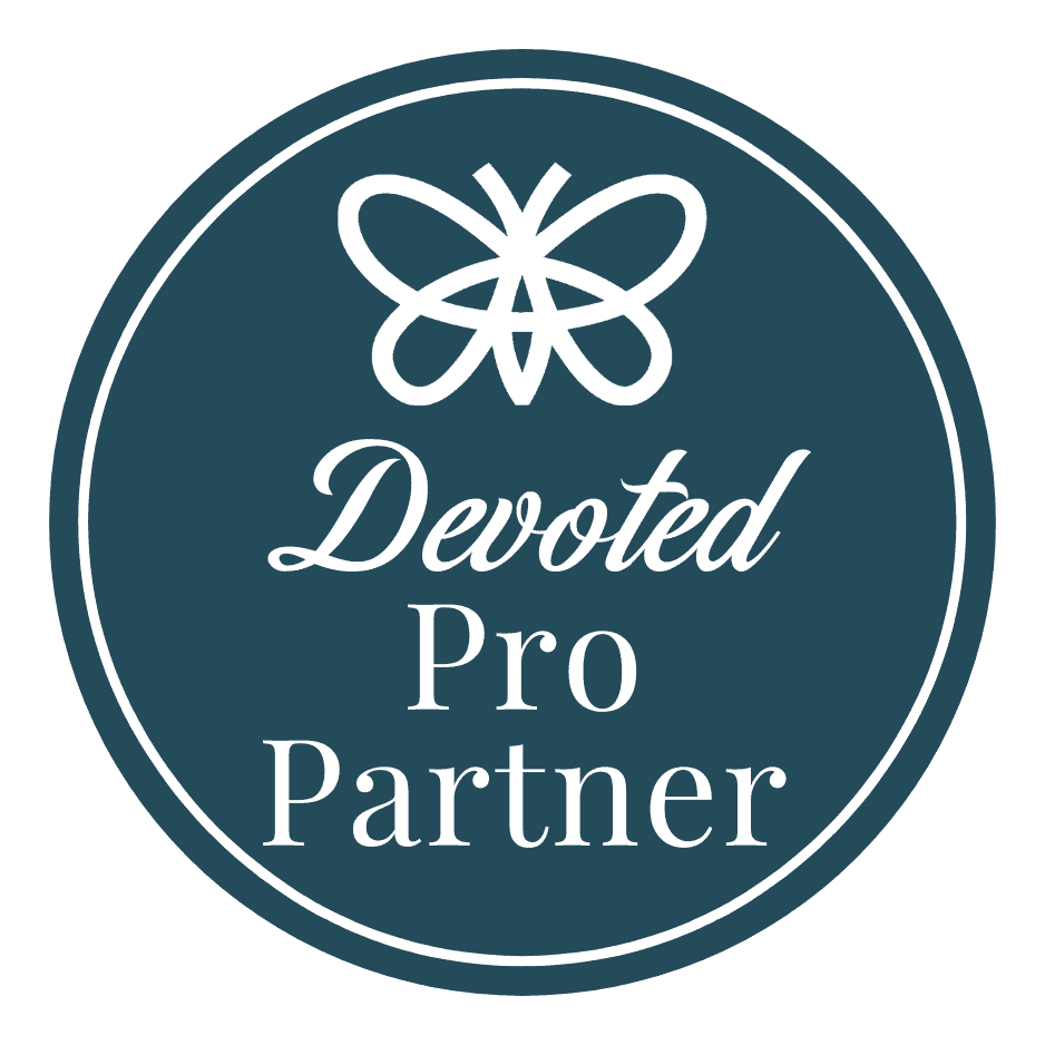 Circular badge with a butterfly icon at the top and the words "Devoted Pro Partner" in white text on a dark teal background.